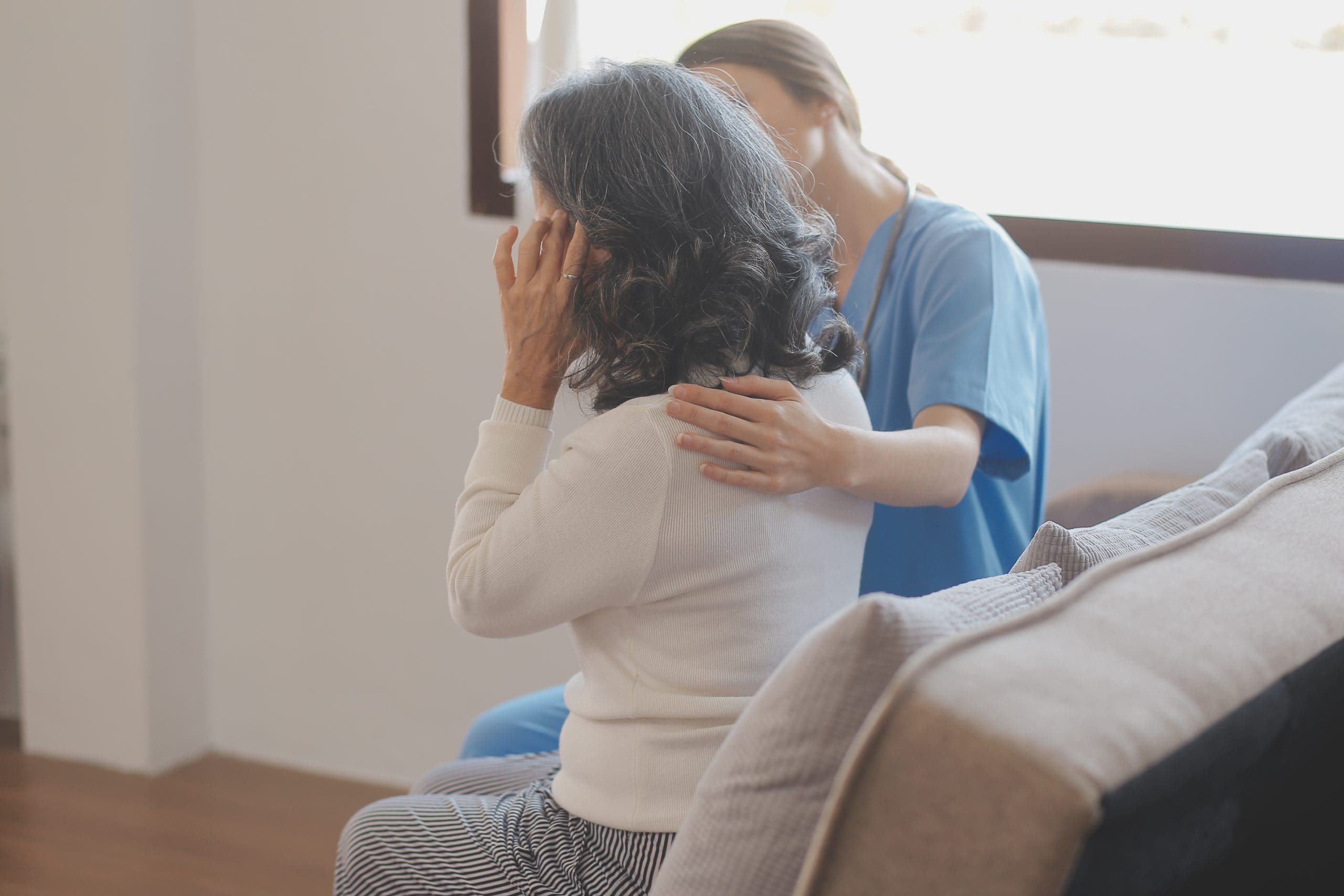 Caring nurse holding
