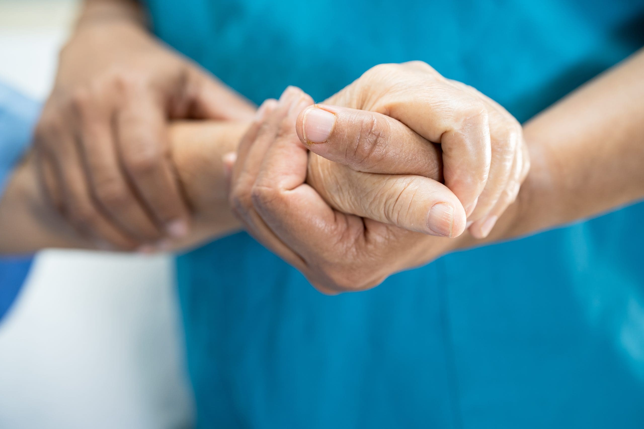 Caring nurse holding